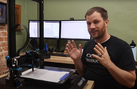 Zach with his puzzling machine, photo: https://www.raspberrypi.com/